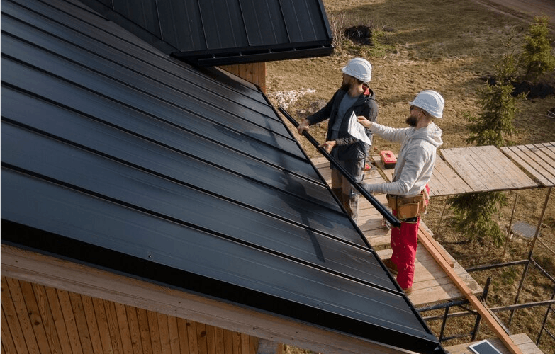 two men working on a roof