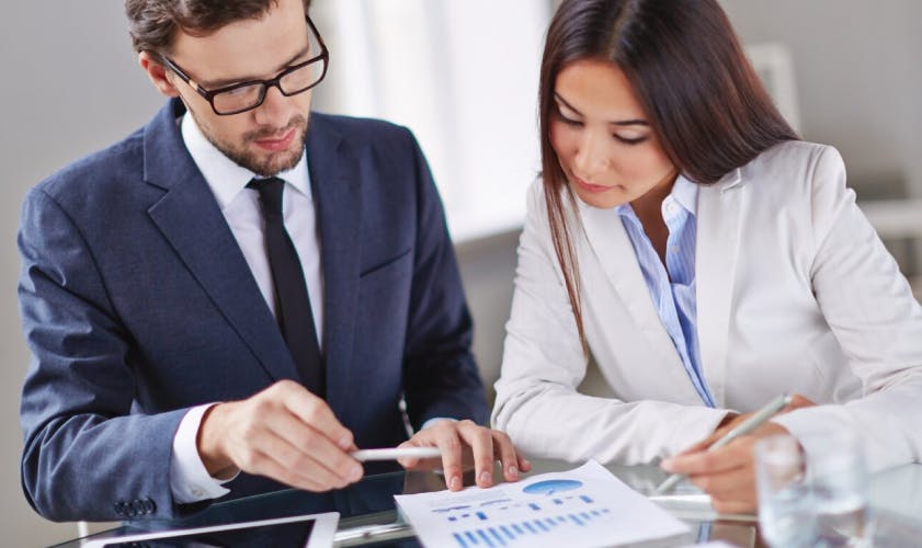 Two people reviewing an estimate