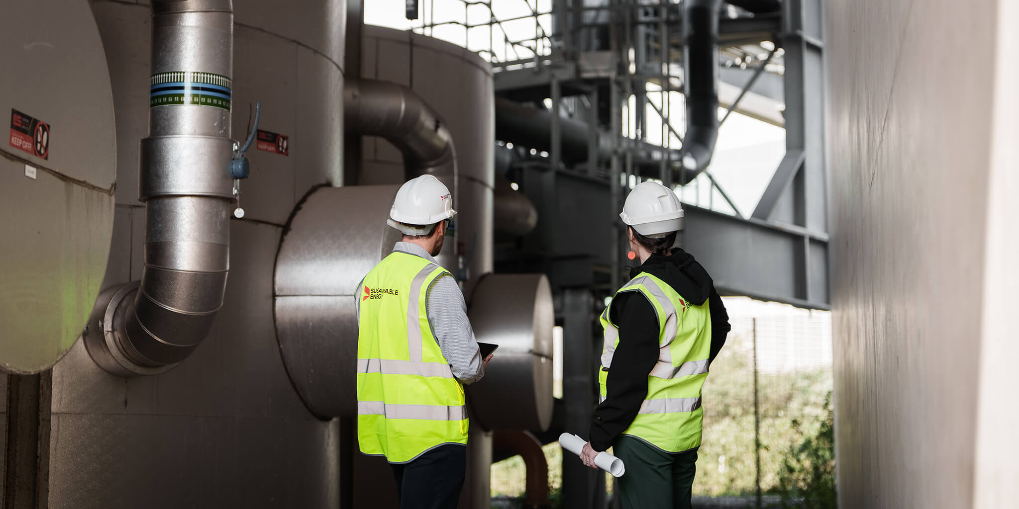 Two engineers inspecting a network system