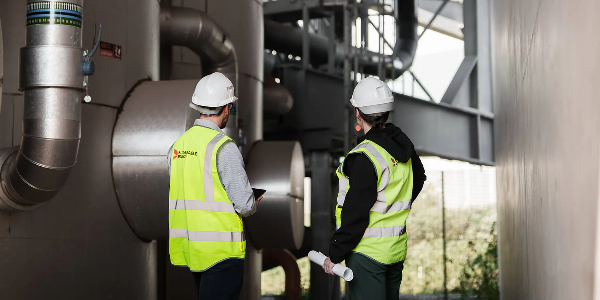 Two engineers inspecting a network system