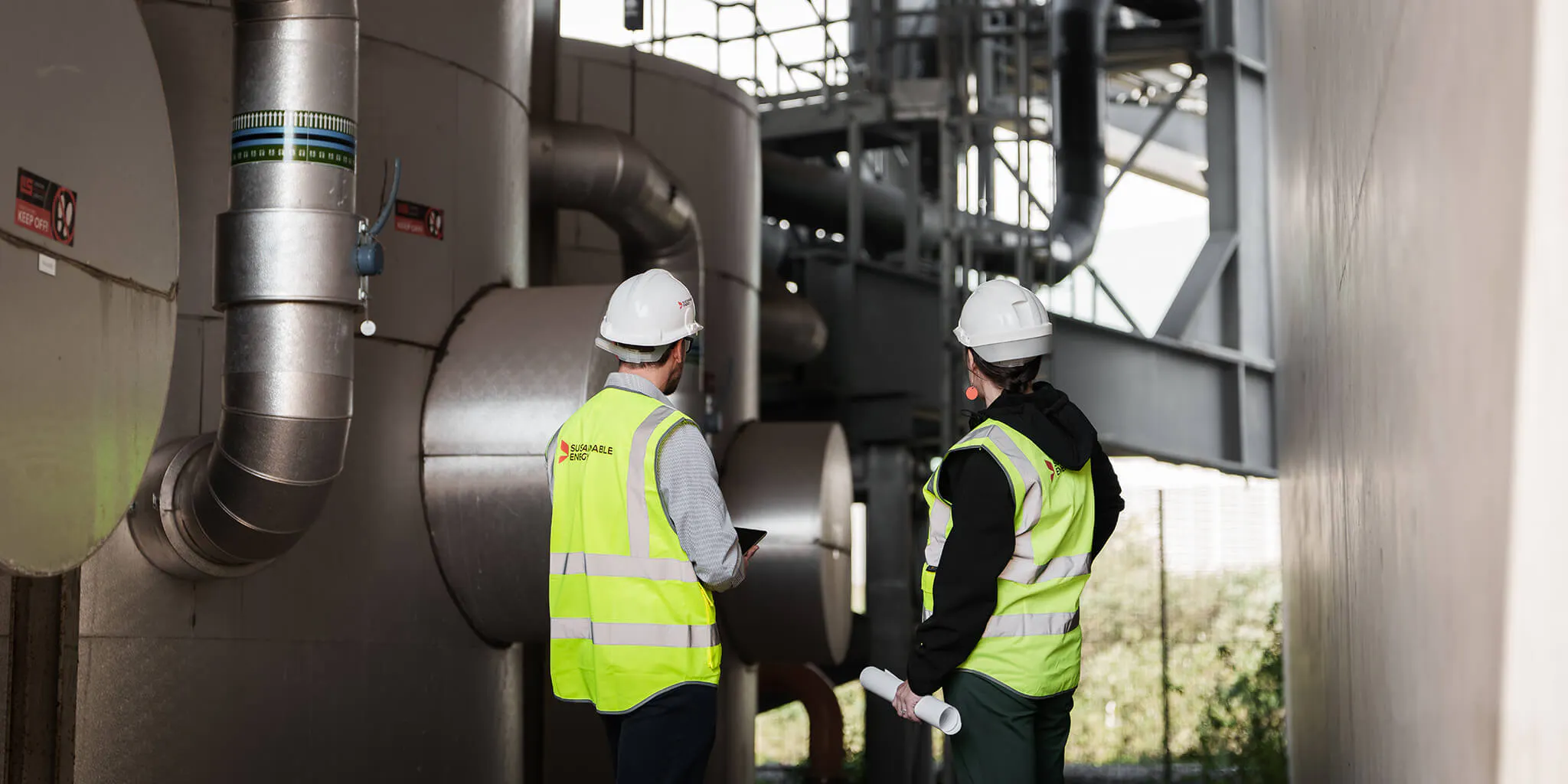 Two engineers inspecting a network system