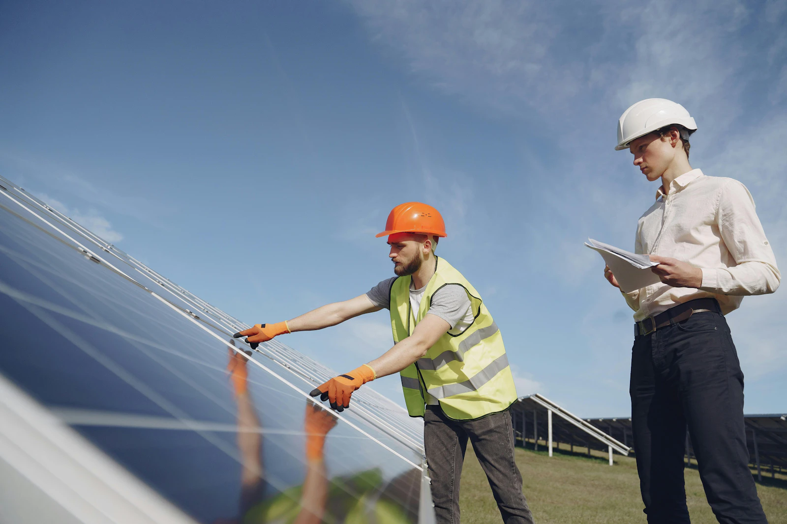 two engineers setting up solar panels