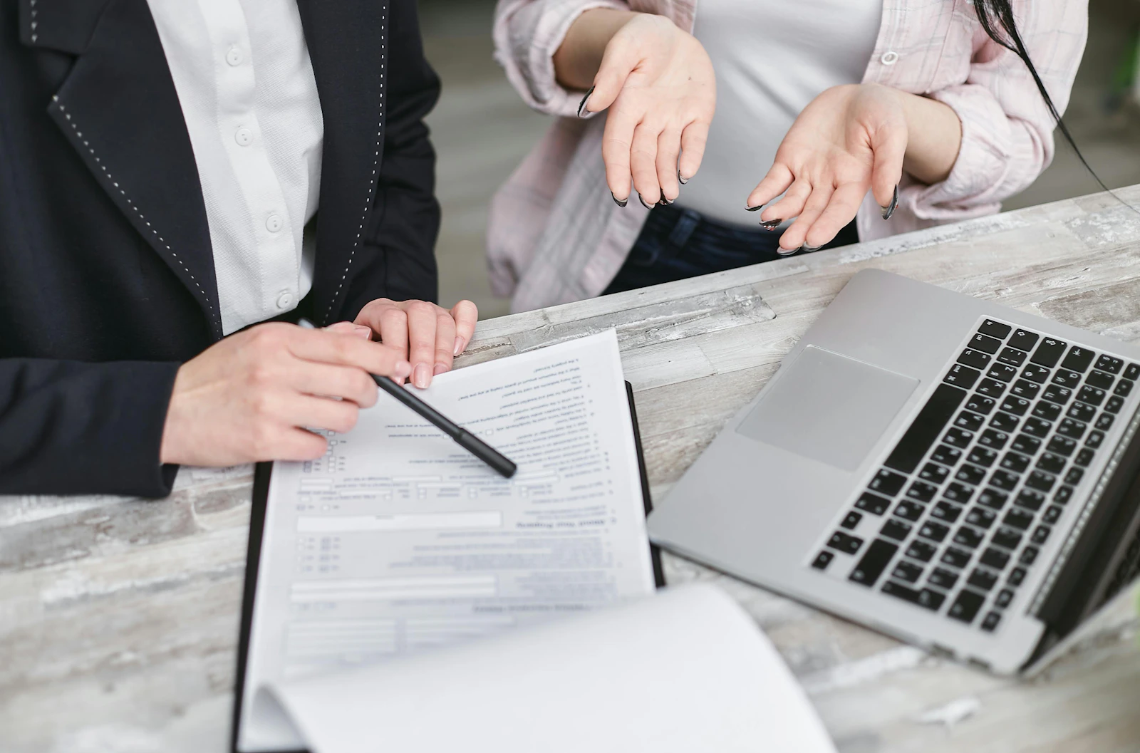 Employee and manager discussing labor law compliance in a modern office