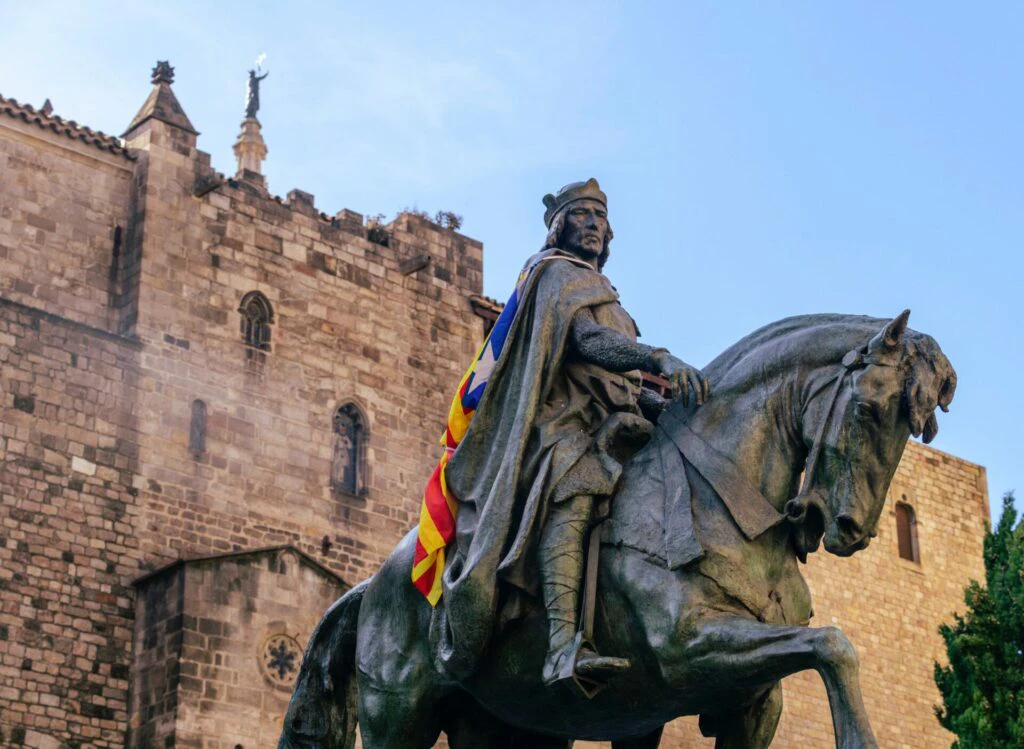 Historic statue in front of an old building in Spain
