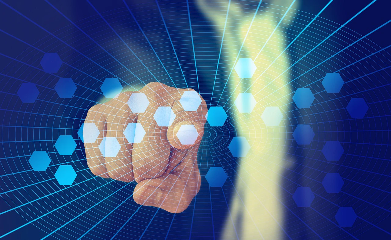 a finger pointing at a digital grid overlay