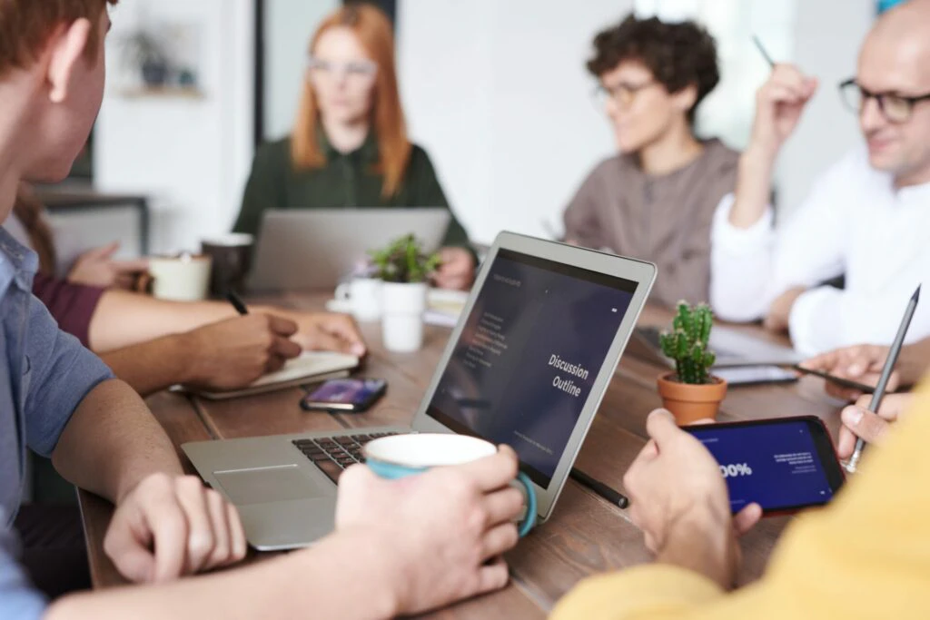 a small team of colleagues working in a modern conference room