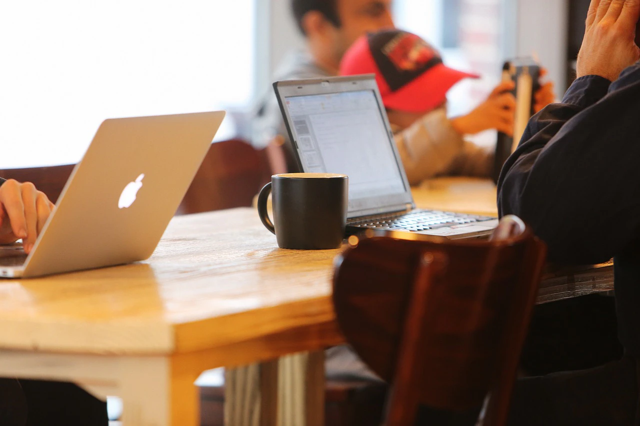 remote workers in a coffee shop