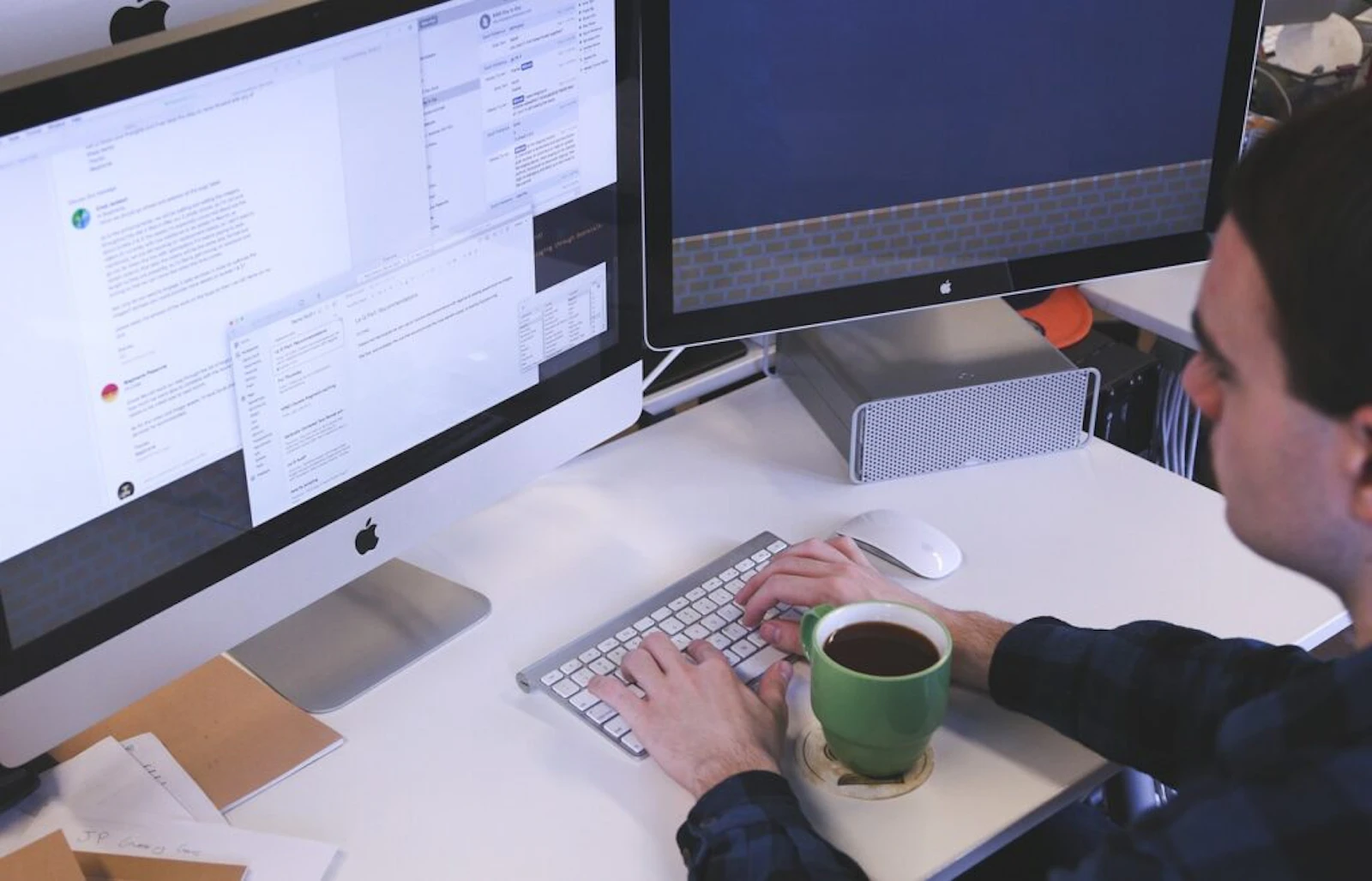 A person working on a computer screen in a modern office