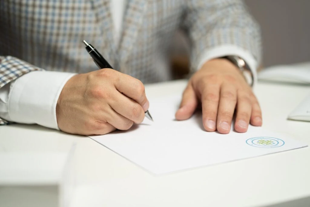 a person signing a contract