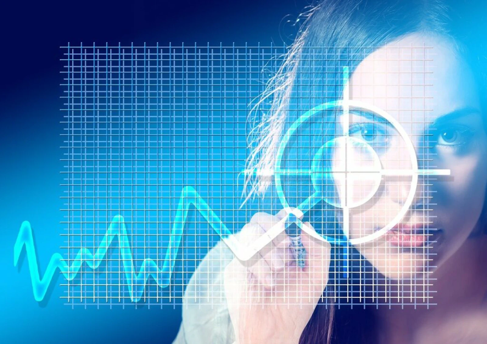 Woman examining digital data charts on a glowing blue screen