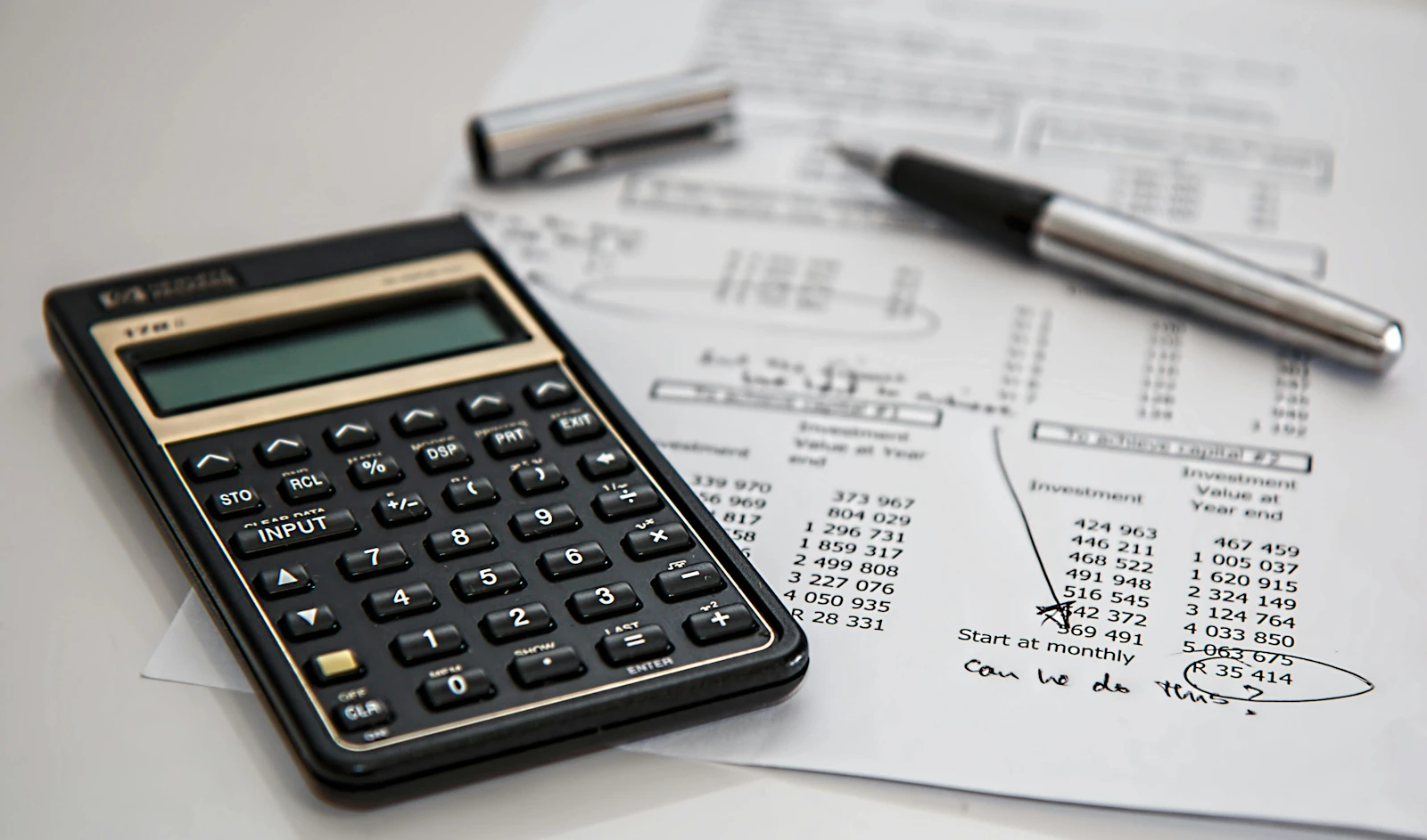 Payroll documents and calculator representing Iceland employer payroll obligations
