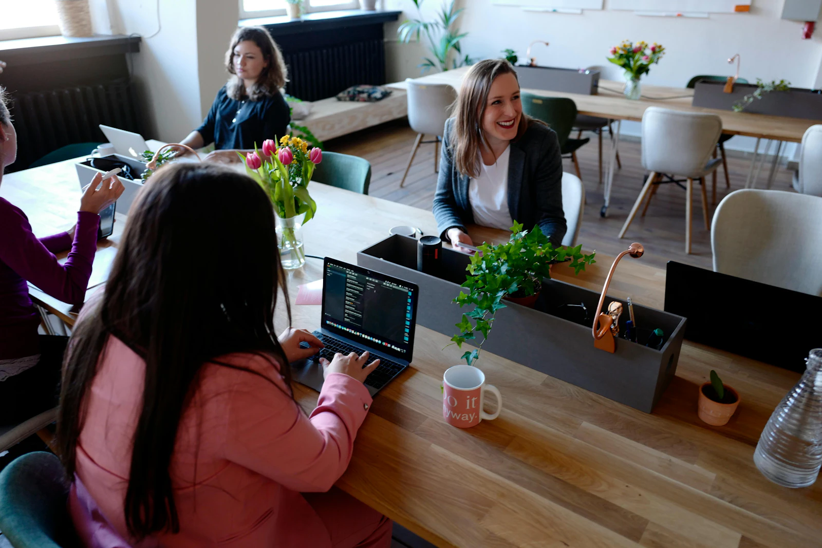 Four women in a meeting in a modern office