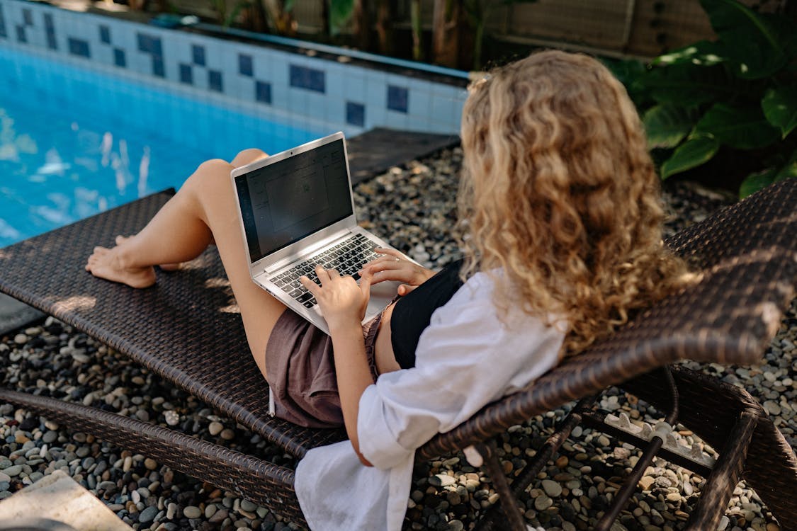 Woman Sitting on the Sunlounger