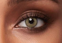 Dark brown eyes after wearing SWATI Jade - Green Coloured lenses