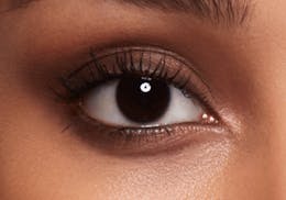 Dark brown eyes after wearing SWATI Jade - Green Coloured lenses