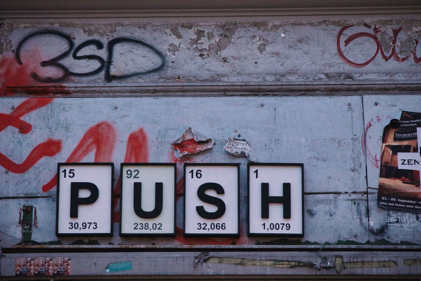 The word push in front of tin wall