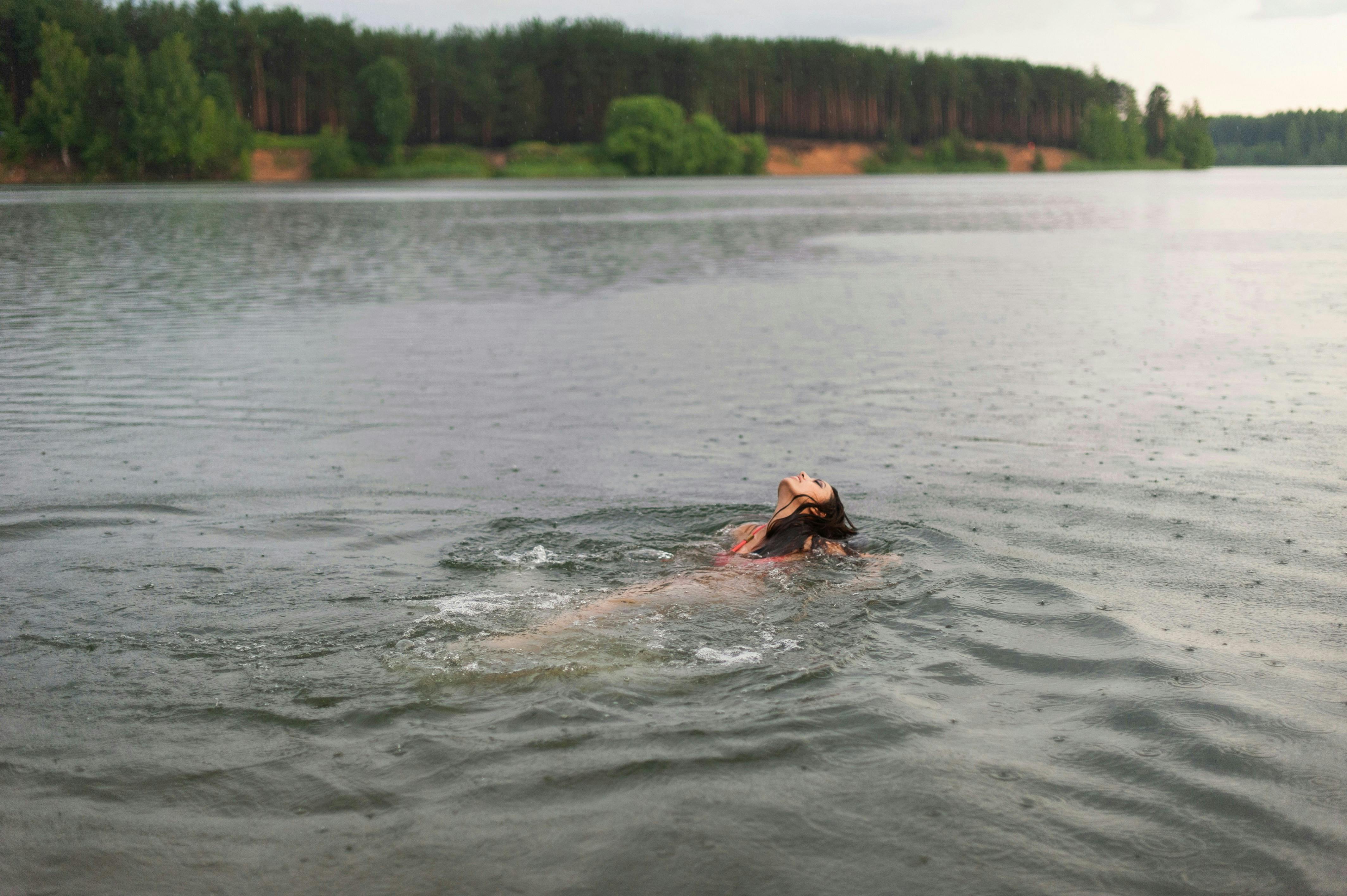 Person Floating In Lake