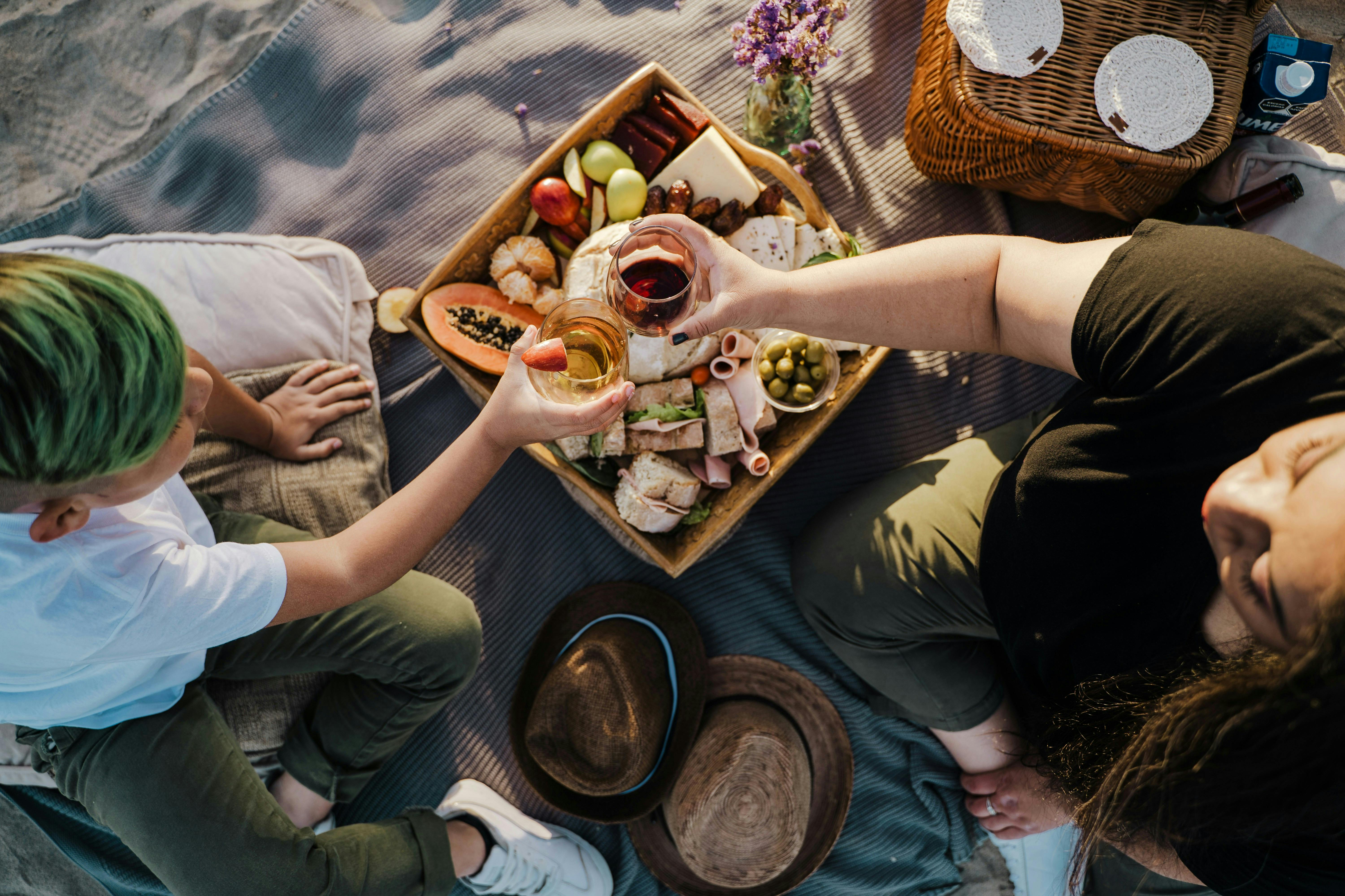 Two people having a picnic on a beach