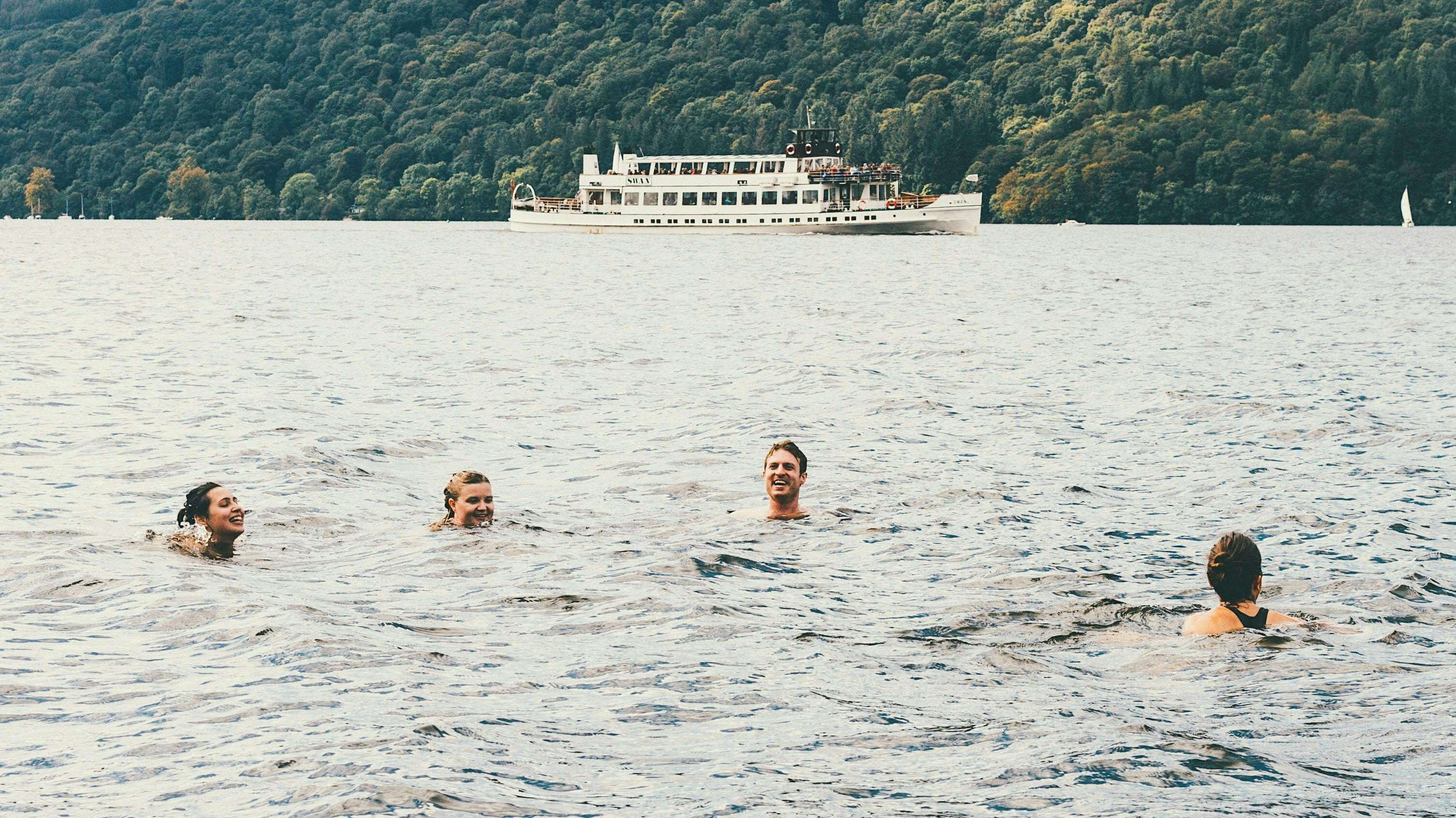 People swimming in a lake