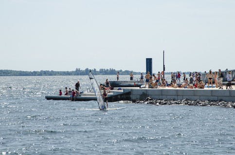 People standing on the pier at Gord Edgar Downie Pier in Kingston Ontario 