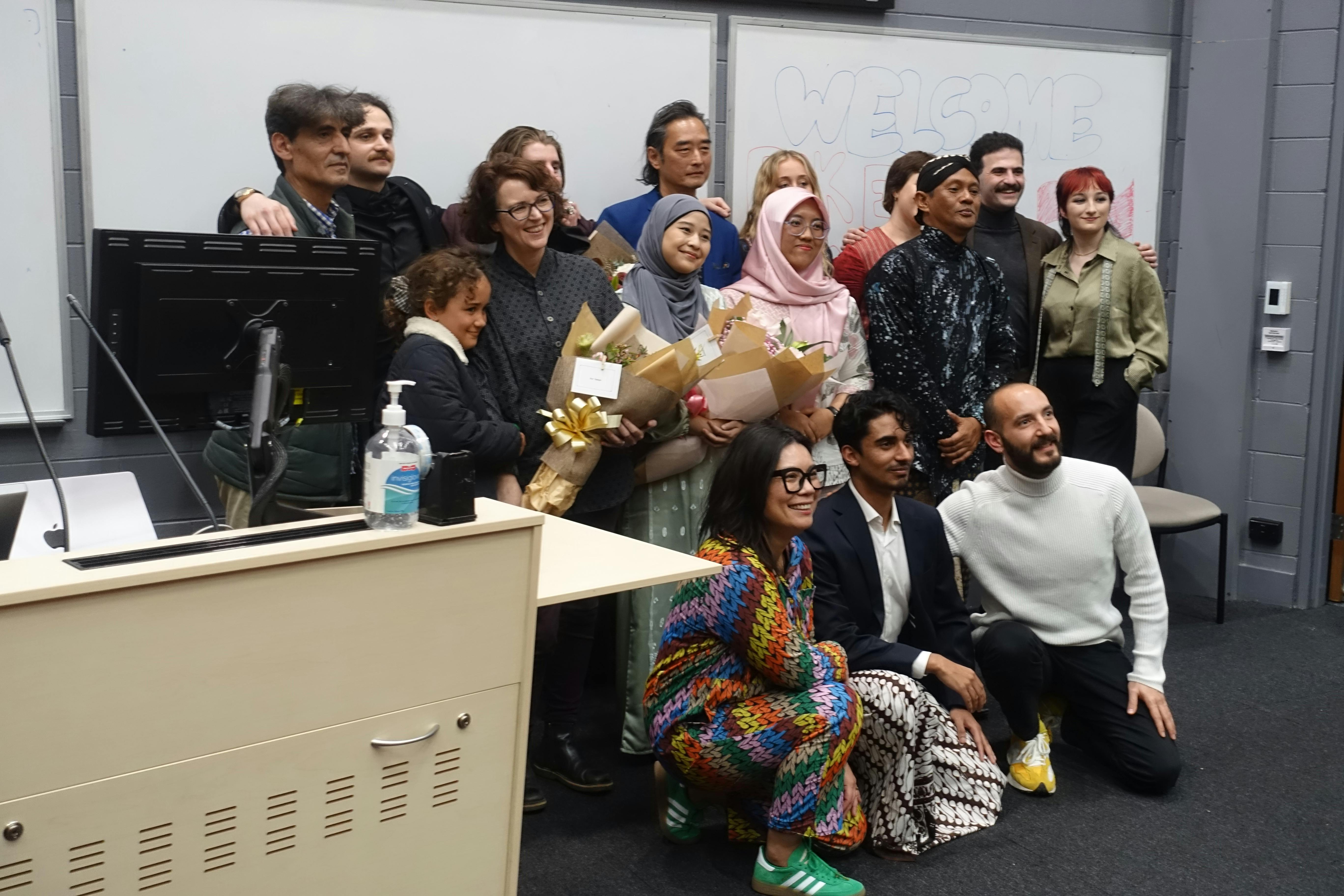 A group of students pose for a photo with Vincent Tay, Tanya Notley, Pak Eko and Mbak Yosa at a screening of their films. 
