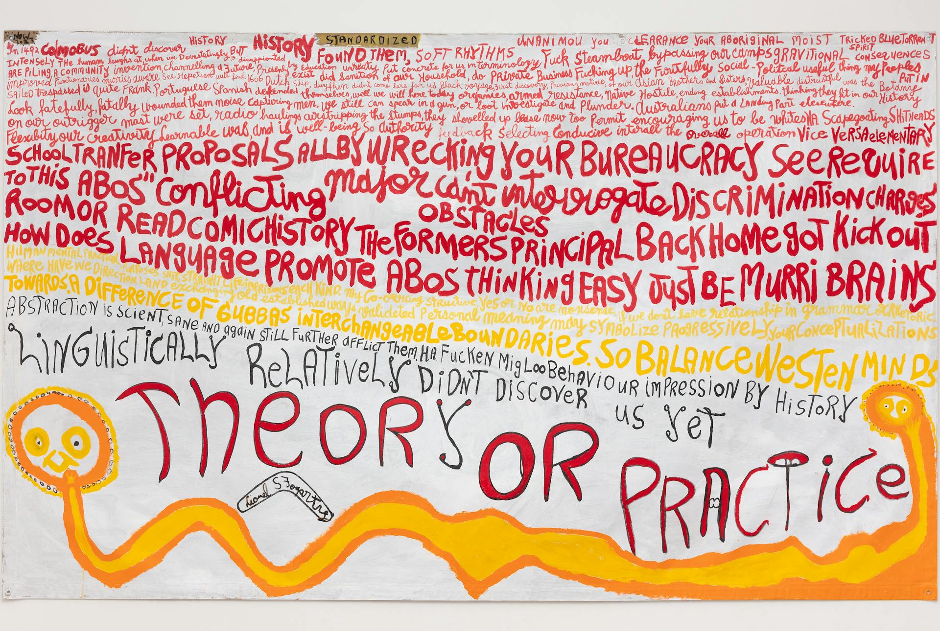 Standardized by Lionel Fogarty. Red yellow black lettering on white background.