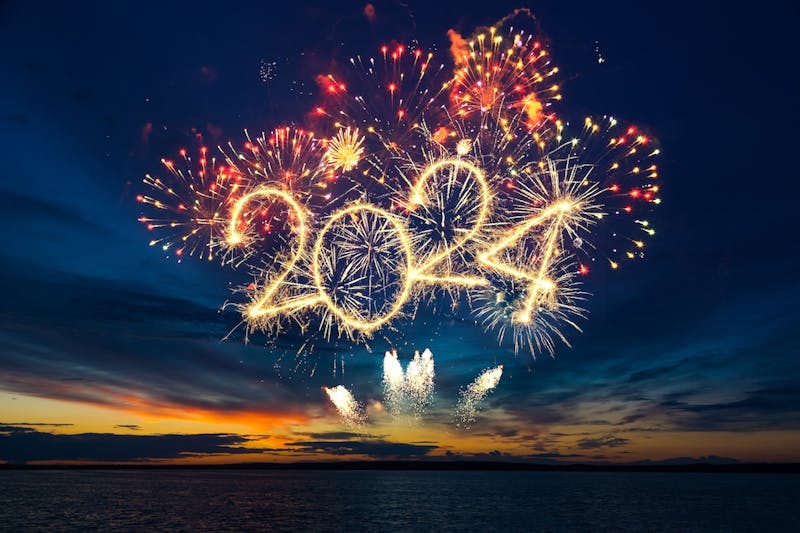 Fireworks display with 2024 written in the sky Fireworks display with 2024 written in the sky