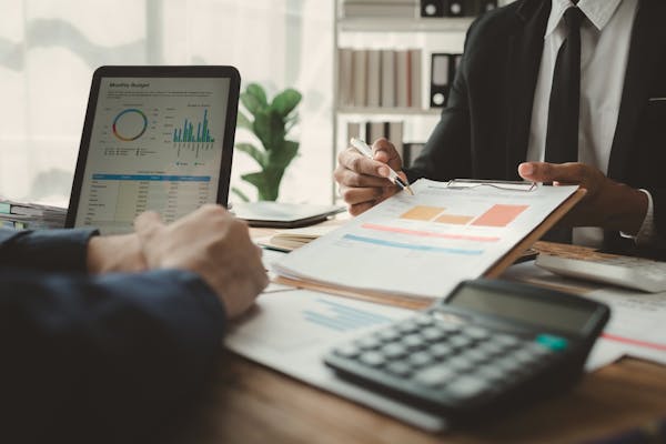 Graphs analyzing costs of building payroll tax compliance