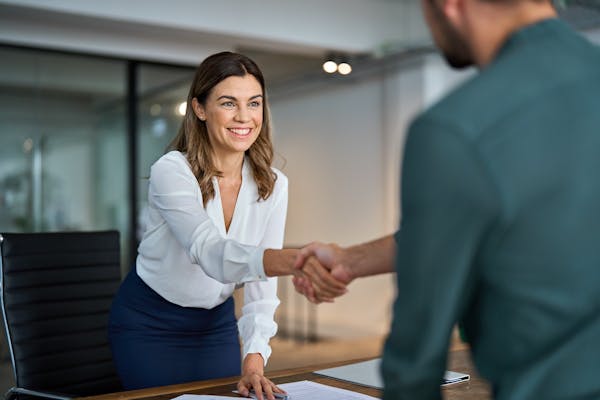 Person shaking hands in an office