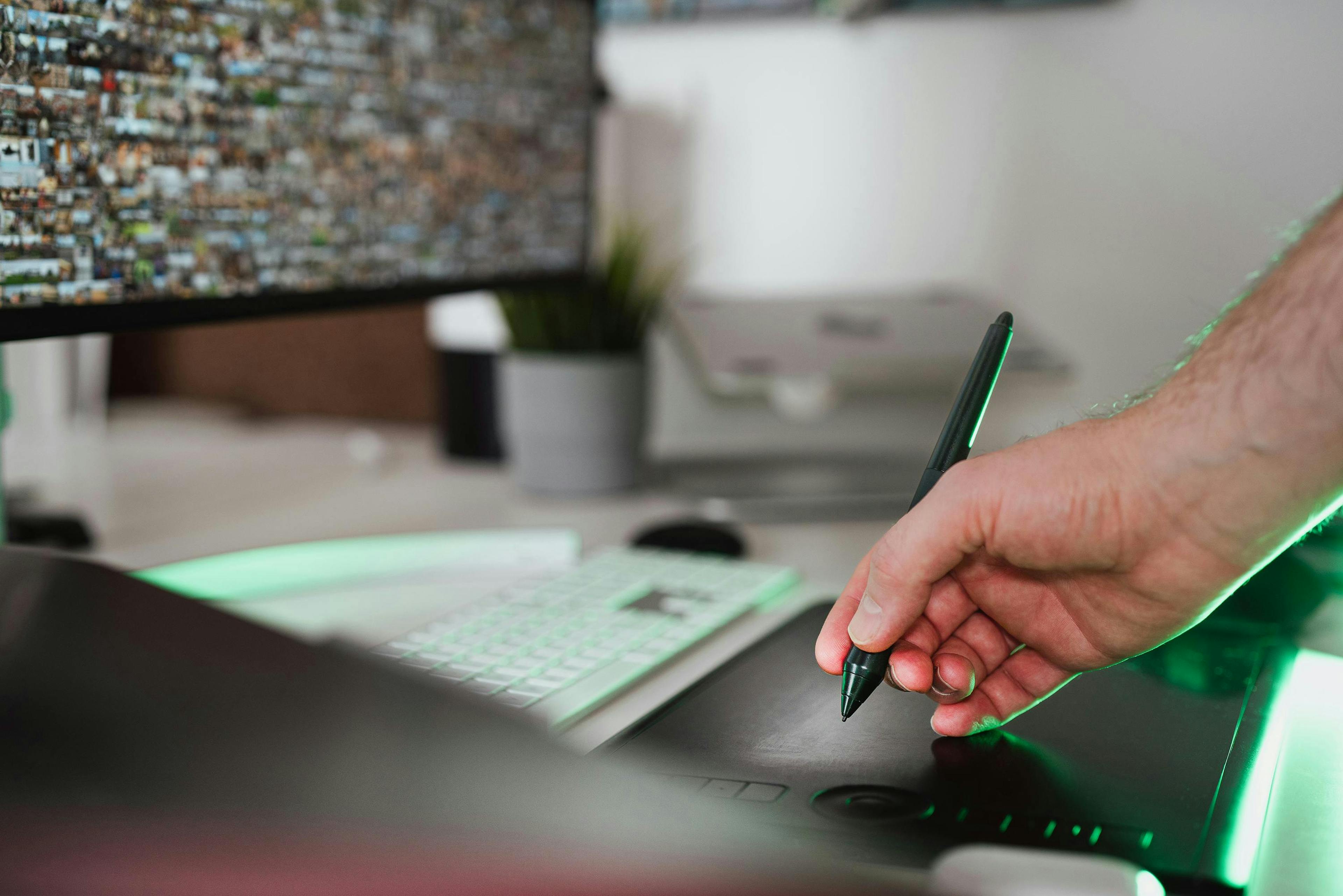 Image of hand working on laptop