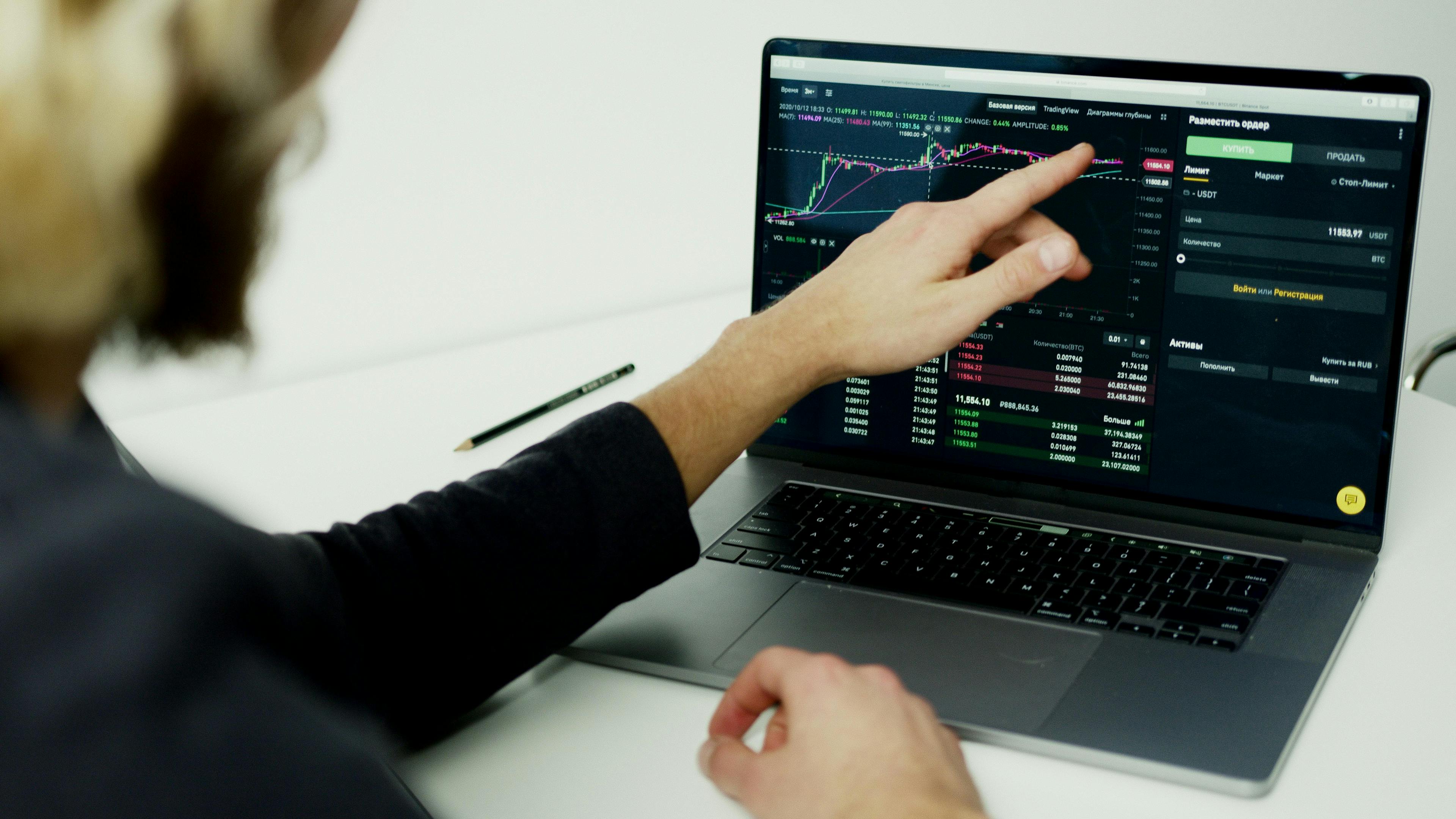 Image of man pointing at graph