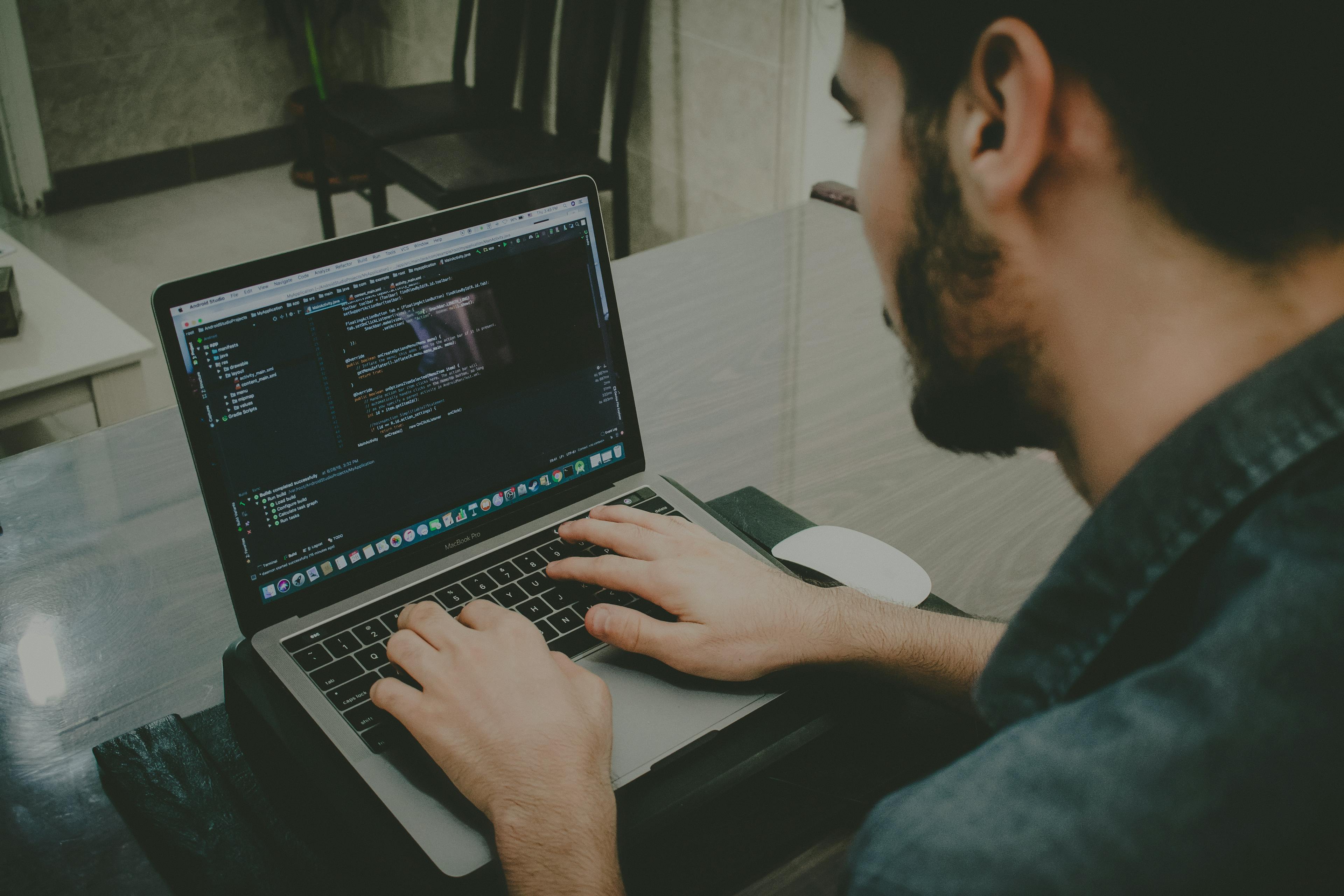 Image on man working on laptop