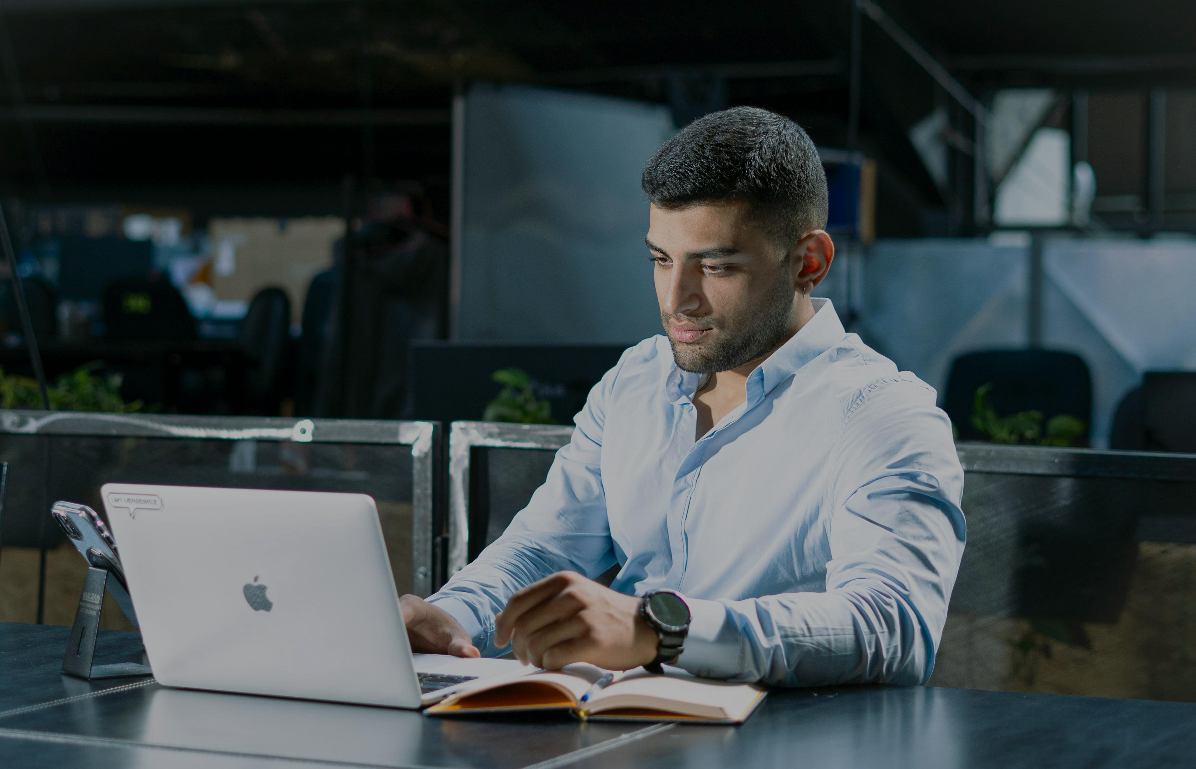 Image of man working on laptop