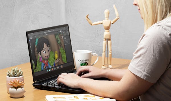 An animator using Adder WS laptop with Blender.