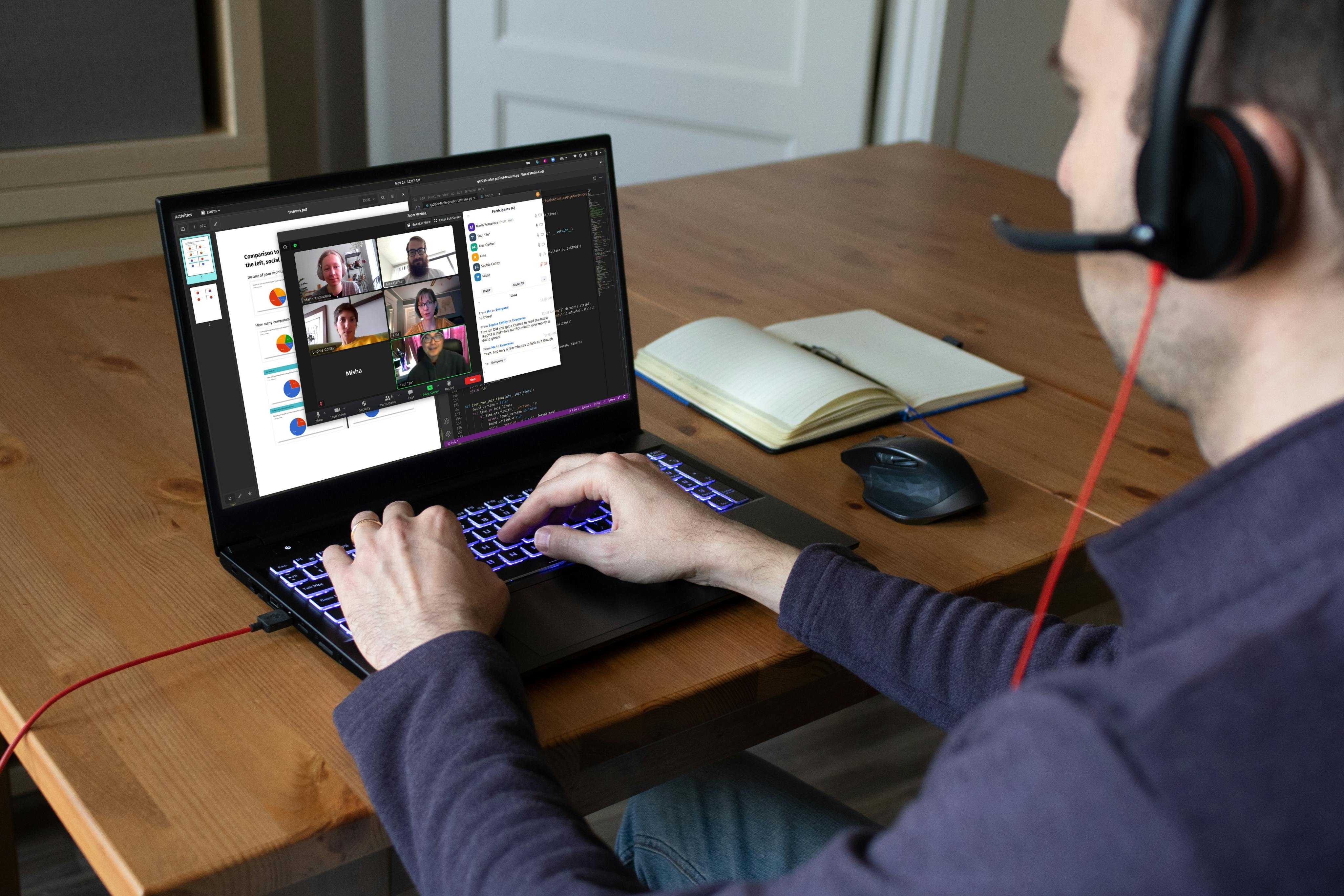 A person using a Pangolin laptop for a video conference meeting.
