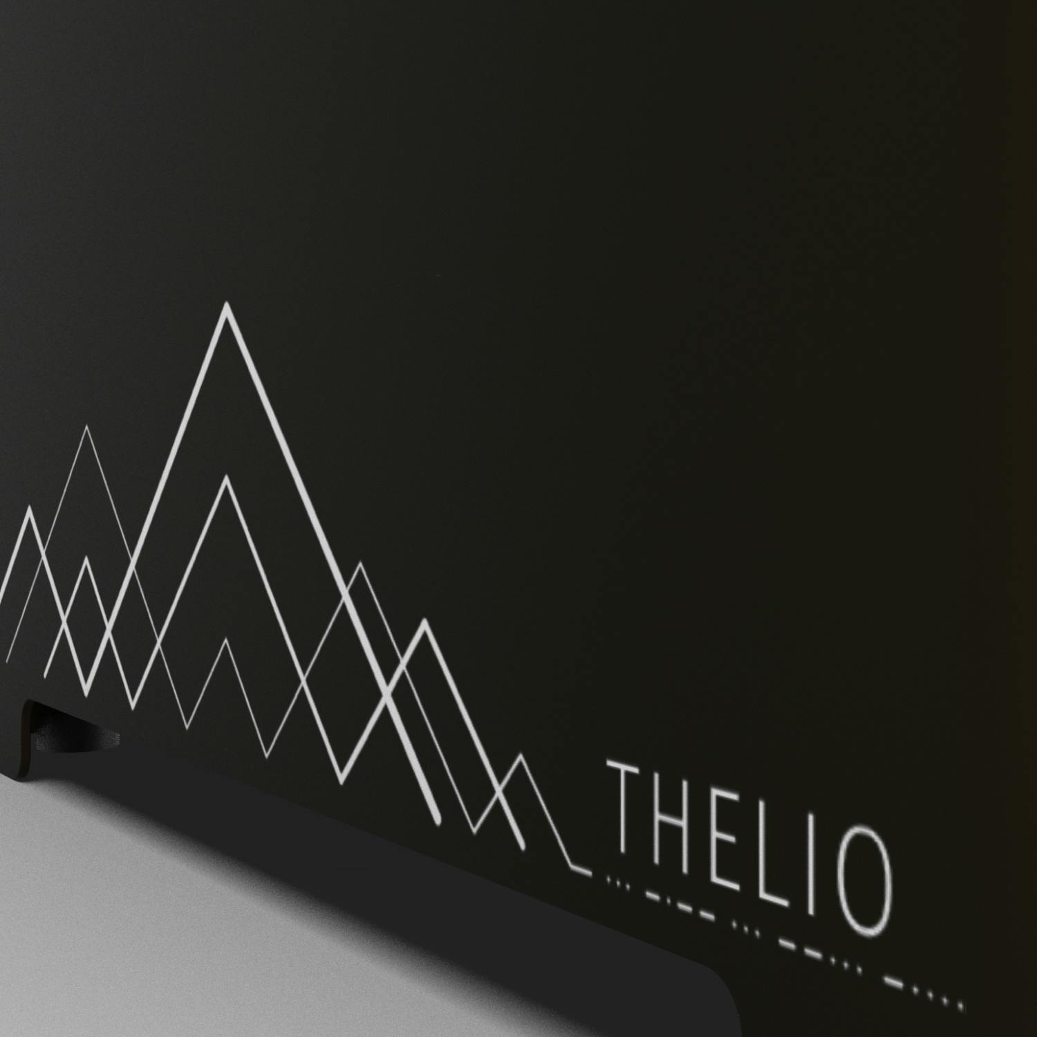 Detail of the machine exterior showing geometric etching of mountains.