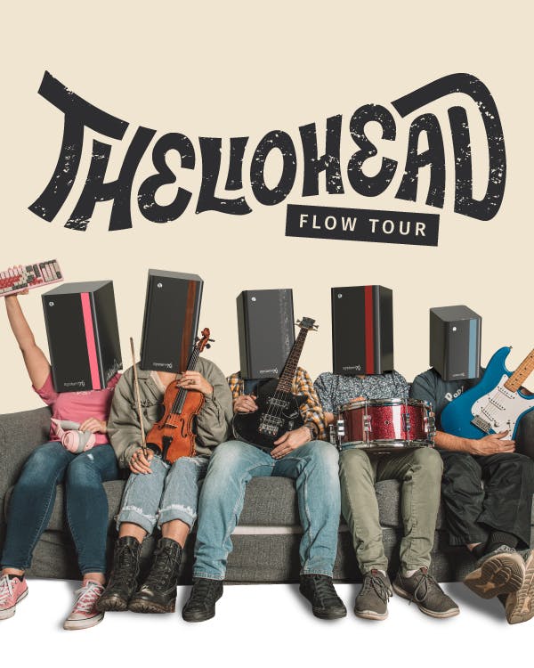 The band THELIOHEAD, made up of people wearing the Thelio Spark, Thelio, Thelio Mira, Thelio Major, and Thelio Mega computer cases on their heads, sit on a couch holding their musical instruments.