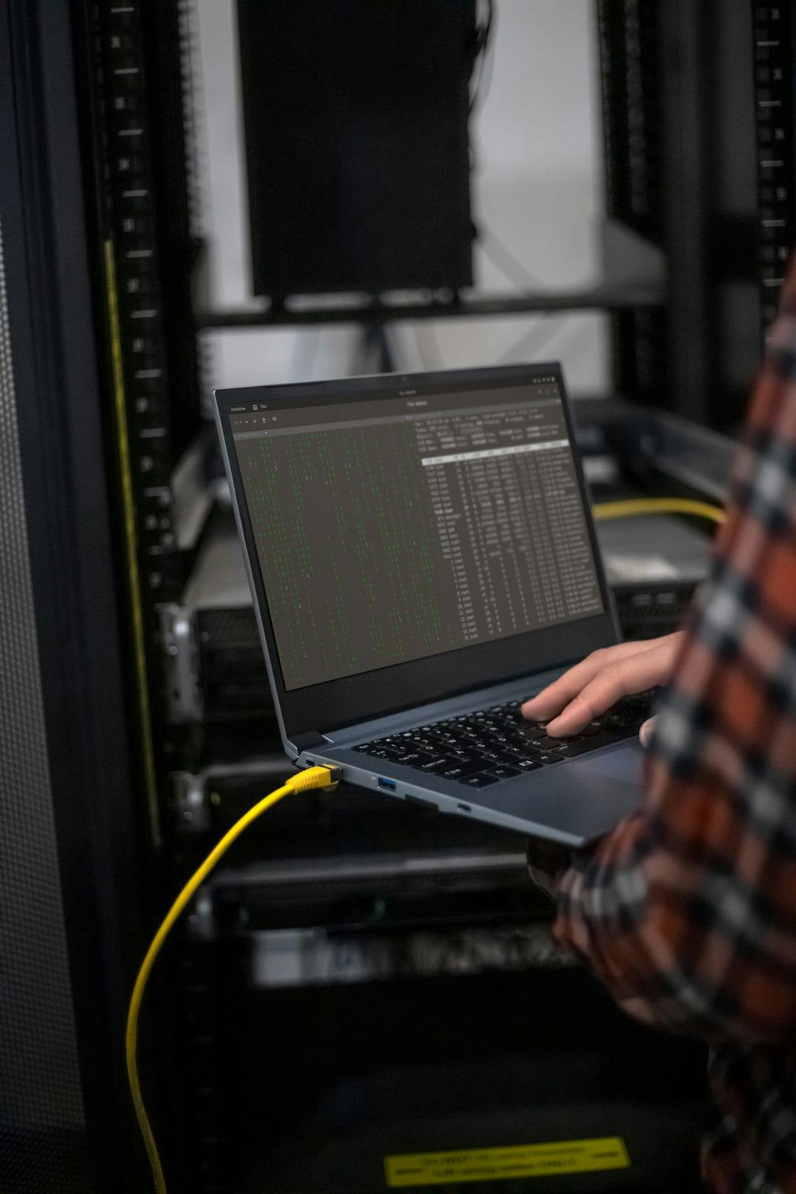A person using the Galago Pro to connect to a server via Ethernet.