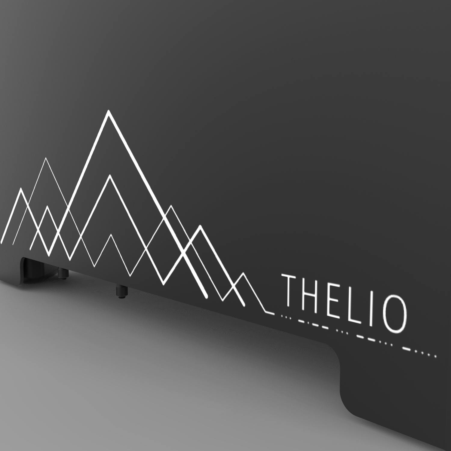 Detail of the machine exterior showing geometric etching of mountains.