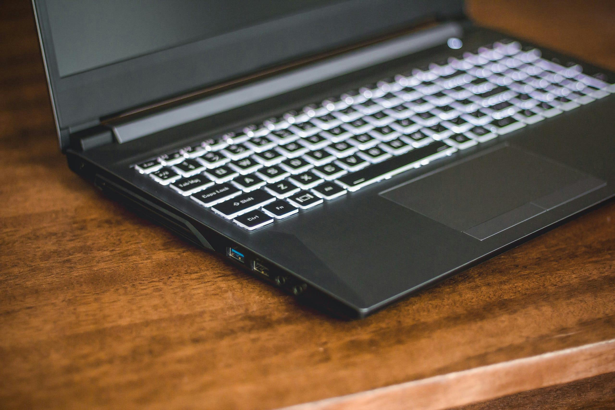 A close-up of the geometric Gazelle laptop chassis on a wooden table.