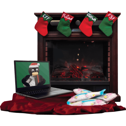 Holiday scene with fireplace, hung stockings, a laptop with tux the penguin as its wallpaper and a pile Tux's favorite fish