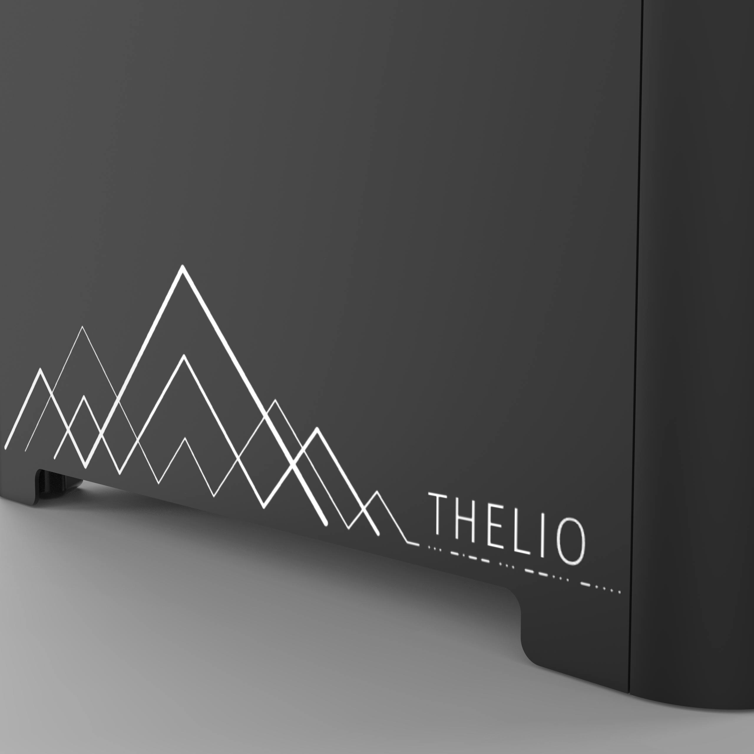 Detail of the machine exterior showing geometric etching of mountains.