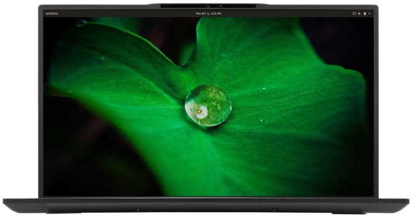 The Darter Pro laptop featuring a vivid wallpaper of dew on a leaf.