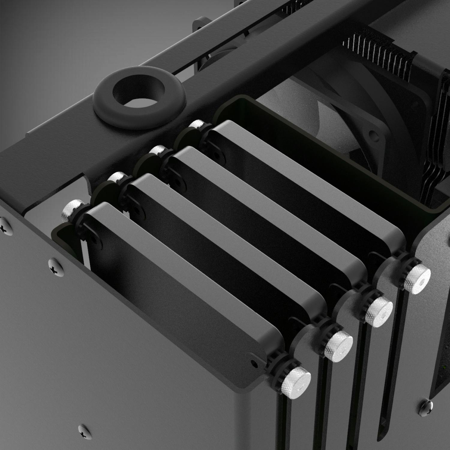 Detail of the machine interior showing storage drives inside the aluminum cage.