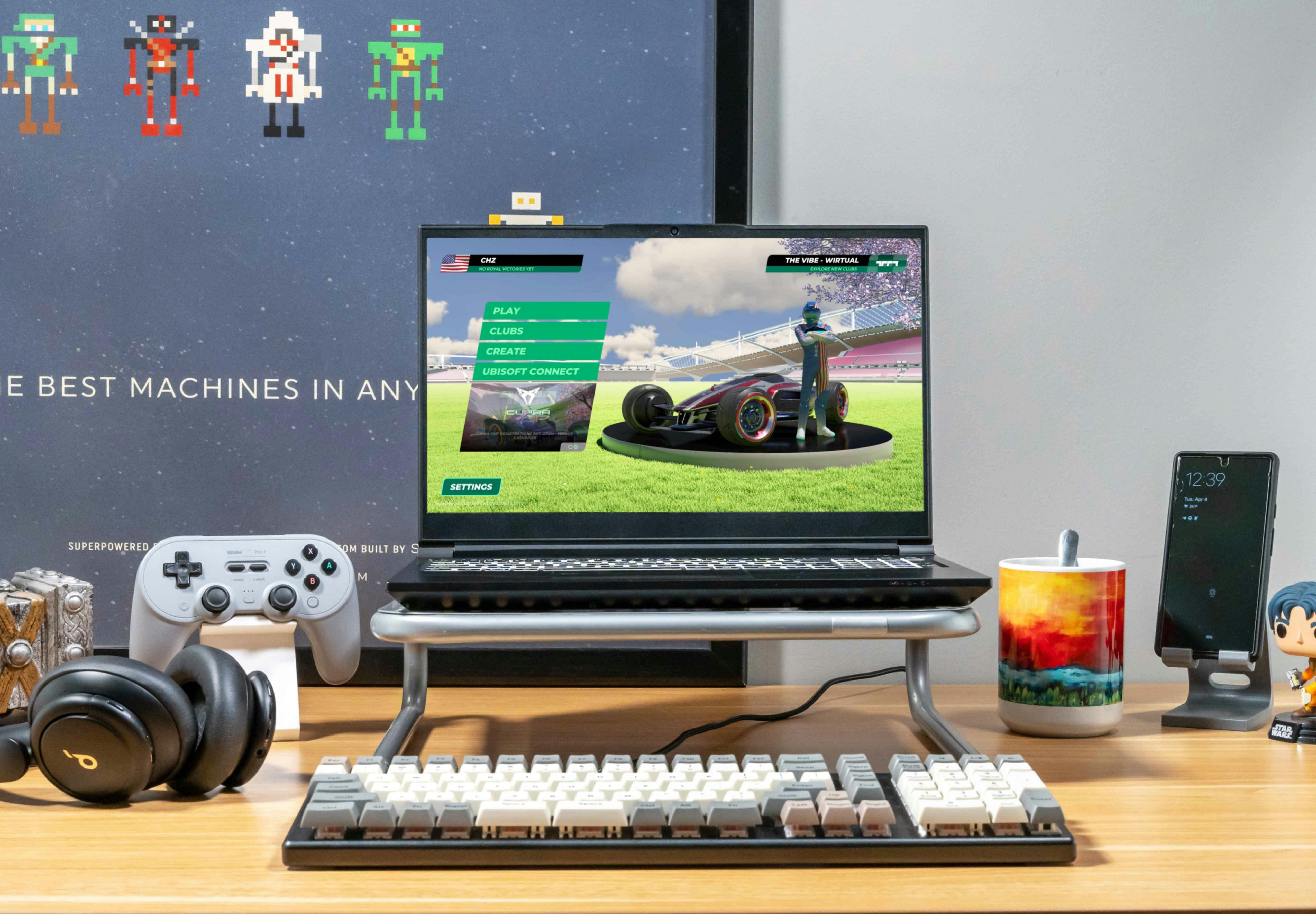 A gamers Serval laptop sitting on a desk with a video game menu loaded. 