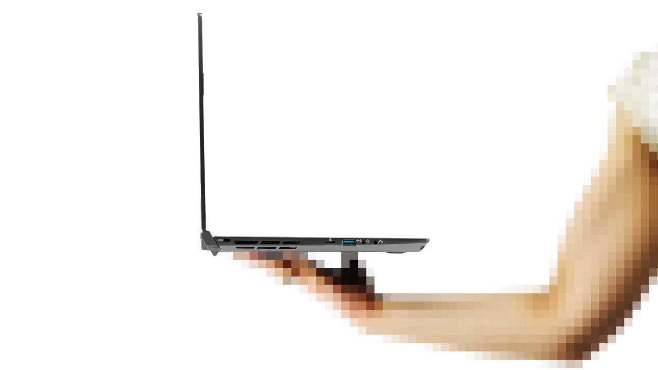 Someone holding the slim Oryx Pro laptop with one hand.