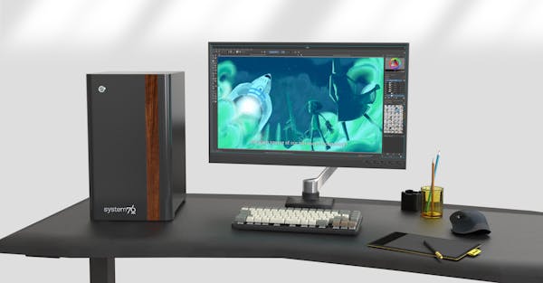 Desk setup with Thelio Mira, external monitor, keyboard, glasses and a coffee mug.