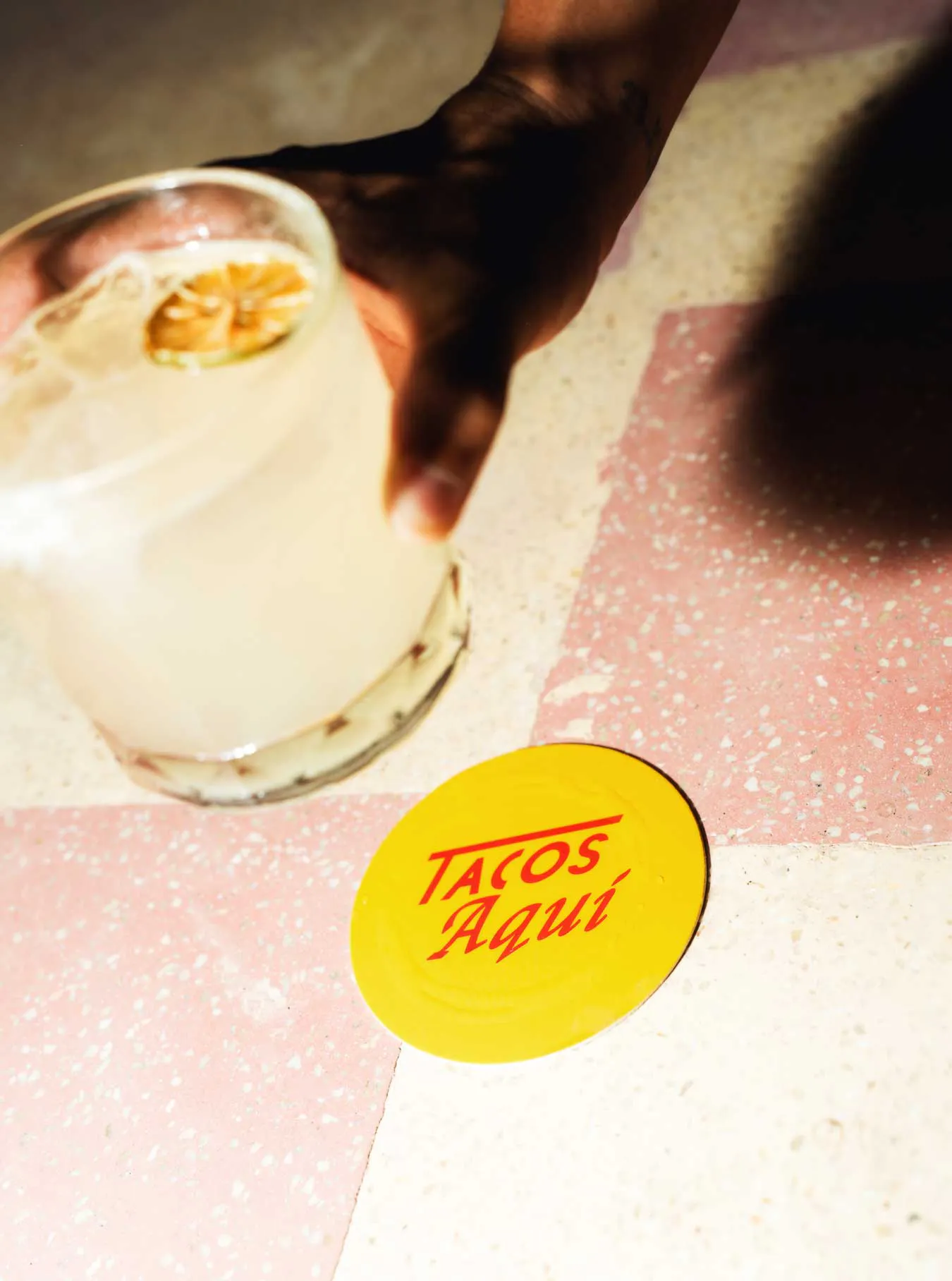 holding a glass of Margarita