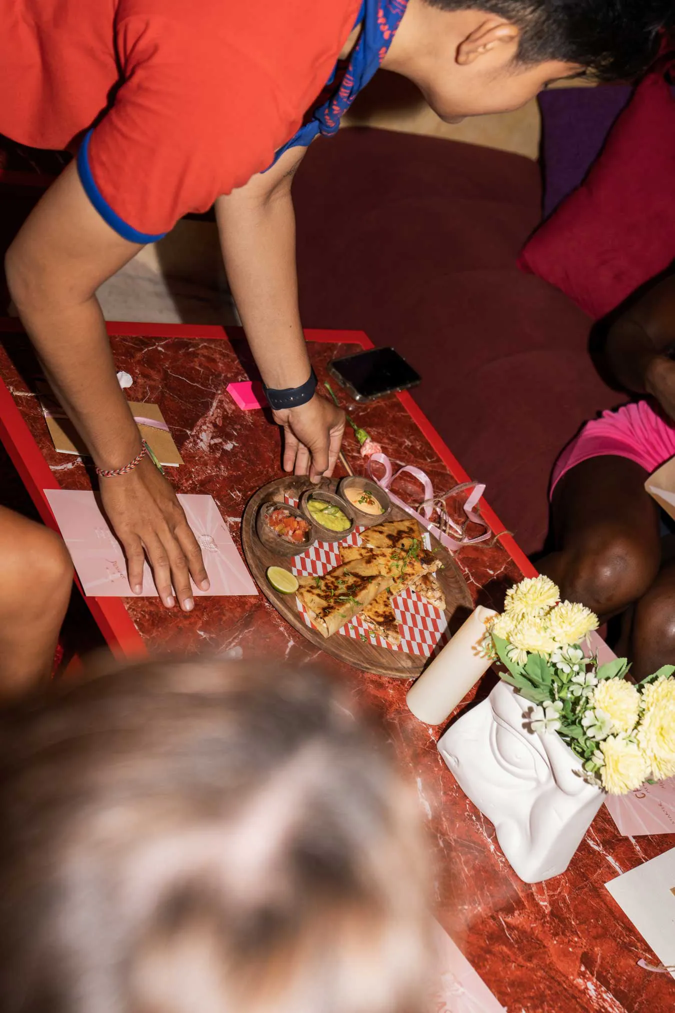 serving Mexican quesadillas with dips at private catered event in Uluwatu Bali venue