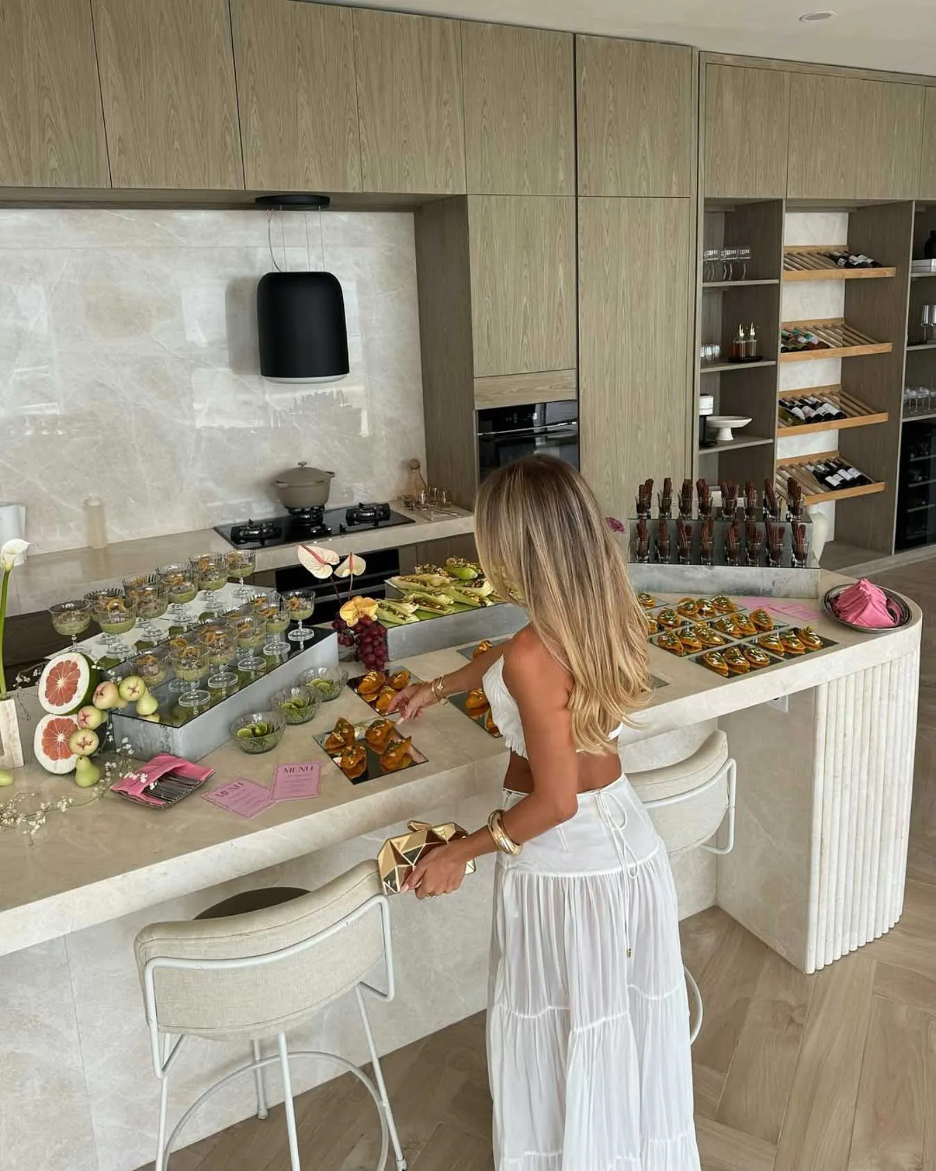 Styled event table with Mexican appetizers, cocktails, flowers and stationery setup for private event